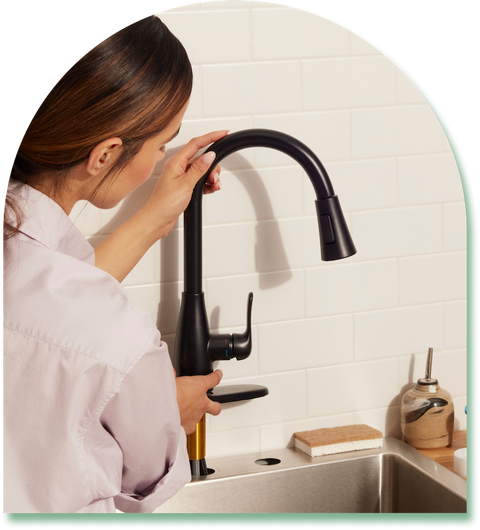 girl installing faucet